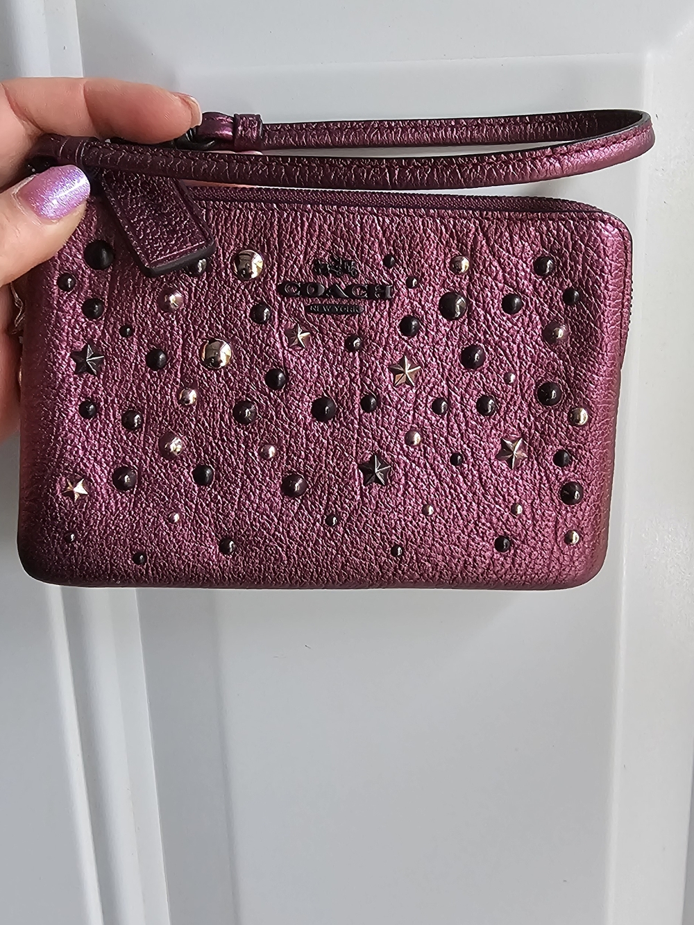 COACH Metallic Plum Wristlet with Stud & Star Detail